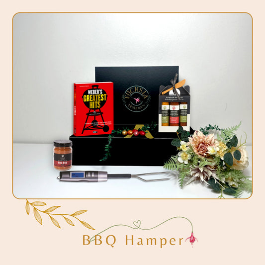Fire up the grill with our BBQ Hamper! Packed with sauces, seasonings, and tasty treats for the ultimate outdoor feast.